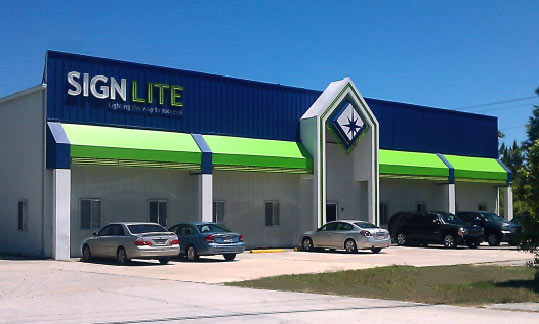 The Sign Lite building viewed from the front during the day.